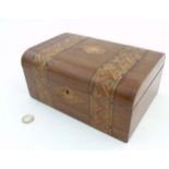 A 19thC semi-domed walnut box with parquetry banded decoration measuring 9 5/8" wide x 7" deep x 4