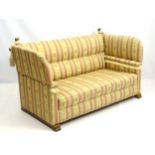 A mid 20thC knoll sofa and matching armchair,