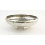 Arts and Crafts : A four foot hammered silver plate bowl by J B Chatterly & Sons ltd. Marked under.