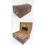 A late 20thC semi-domed lacquered walnut cigar humidor with hygrometer,