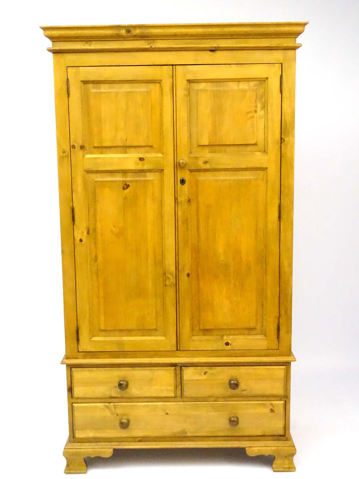 A mid / late 20thC pine wardrobe with an ovolo moulded top above two doors containing storage space - Image 2 of 9