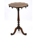 A Regency rosewood occasional table, with drop finials adorning the underside of the table top,