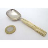 A silver caddy spoon with ivory handle hallmarked Sheffield 1912 maker C W Fletcher & Son Ltd 4