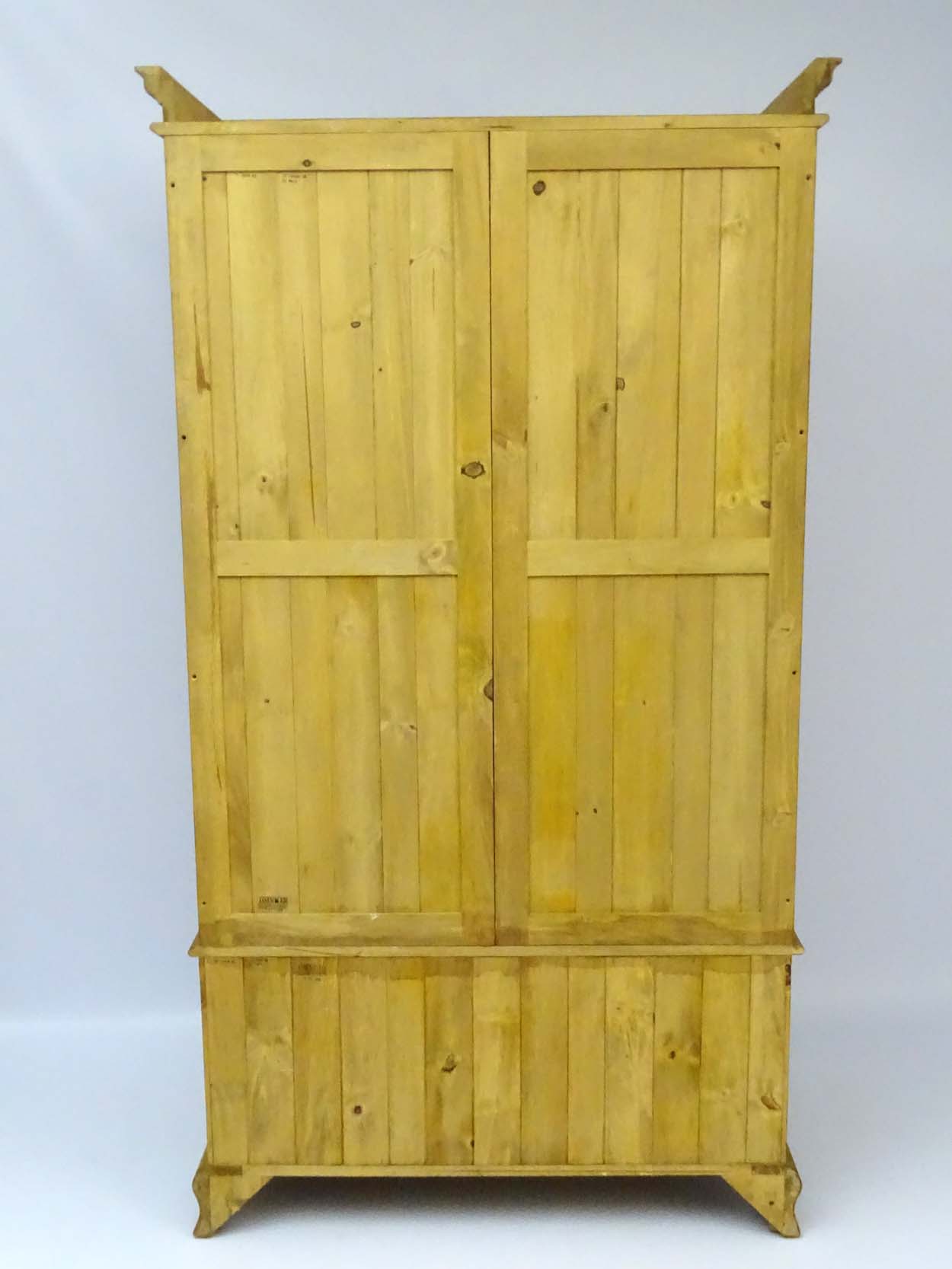 A mid / late 20thC pine wardrobe with an ovolo moulded top above two doors containing storage space - Image 7 of 9