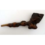 Black Forest : A carved wooden pipe of foliate form 3 1/2" long CONDITION: Please
