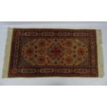 Rug / Carpet : A 20thC Turkish woollen rug with geometric corner pieces,