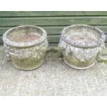 Garden and Architectural Salvage : A pair of matched reconstituted stone swag decorated planters of