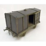 A scale bronze and brass railway carriage with sliding doors 17 1/2" long x 9" high x 7 1/2" wide