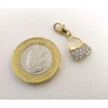 A 14ct gold pendant / fob formed as a basket set with white stones.