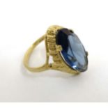 A 9ct gold ring set with facet cut blue stone CONDITION: Please Note - we do not