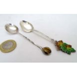 A teaspoon hallmarked Birmingham 1969 with tigers eye cabochon to handle,