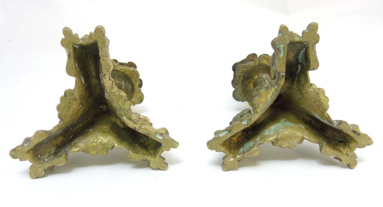 A pair of cast brass tri-form candlesticks having organic formed pedestal and 3 horned beasts to - Image 7 of 7