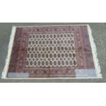 Rug Carpet : A late 20 thC machine made Bokhara rug with beige ground ,