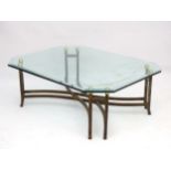 Mid Century Modern : a designer plate glass topped coffee table with 8 brass spheres and 4 pairs of