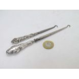 2 silver handled button hooks the longest 6 3/4" long (2) CONDITION: Please Note -