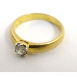 An 18ct gold ring set with diamond solitaire CONDITION: Please Note - we do not
