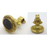 A Victorian yellow metal pendant fob seal with engraved seal under with motto.