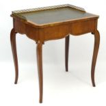 A mid 19thC ladies satinwood desk with side opening drawer gilt metal pieced gallery and gold