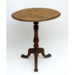 A late 19thC walnut tripod Occasional Table with marquetry inlay and boxwood stringing to the top ,