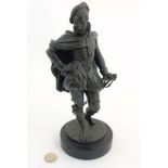 A 20thC Spelter figure of an Elizabethan Gentleman with sword, dagger etc.