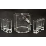 An octagonal glass ice bucket together with 6 octagonal shot glasses.