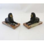 A pair of gilded bronze Egyptian sphinx on onyx bases.
