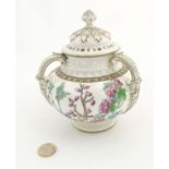 A late 19thC / early 20thC lidded Coalport 3 handled pot pourri pot with cover,