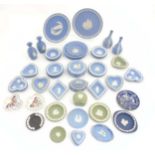 A quantity of Wedgwood Jasperware items comprising small dishes, trinkets/lidded pots, vases,