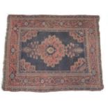 Carpet / Rug: An old Afghanistan rug with mainly dark Salmon ground,