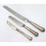 A silver handled knife hallmarked London 1830 8 1/2" long together with a silver bladed butter