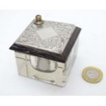 A glass inkwell with wooden slide top having silver decoration hallmarked London 1909 maker M&C.