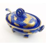 A Victorian Flow Blue Ironstone Staffordshire lidded tureen with serving spoon decorated with
