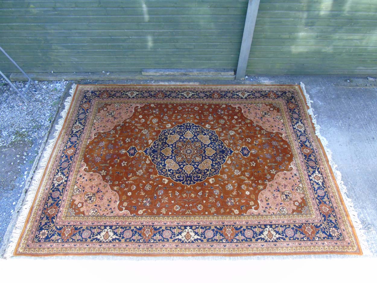 Carpet / Rug : A hand woven woollen carpet with brown ,