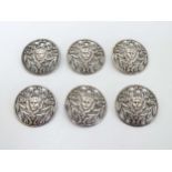 A matched set of 6 silver buttons with foliate and face decoration.
