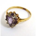 A 9ct gold ring set with purple and white stones CONDITION: Please Note - we do