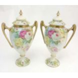 A pair of Vienna style baluster formed lidded vases with twin handles,