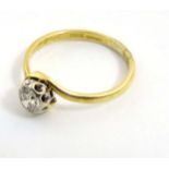 An 18ct gold ring set with central diamond solitaire CONDITION: Please Note - we