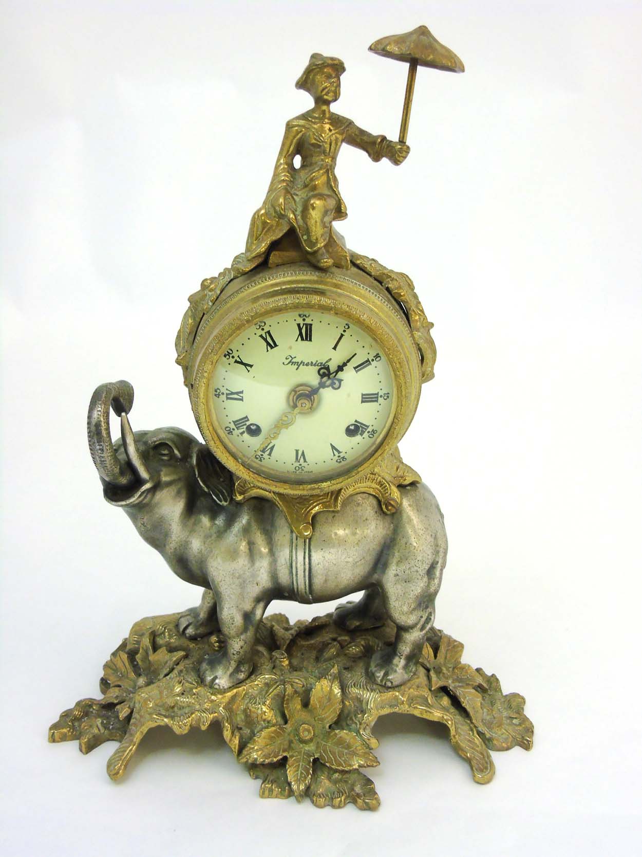 Elephant Clock : an Italian Brevettato brass & bronze elephant mantel clock The top surmounted by a