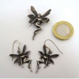 A silver brooch formed as a fairy / nymph together with a matched pair of drop earrings.