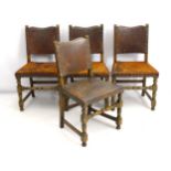 A set of four early 20thC oak dining chairs, with acanthus carved uprights,