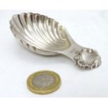 A silver caddy spoon of shell from hallmarked Birmingham 1972 maker Hampton Utilities 3" long (22g)