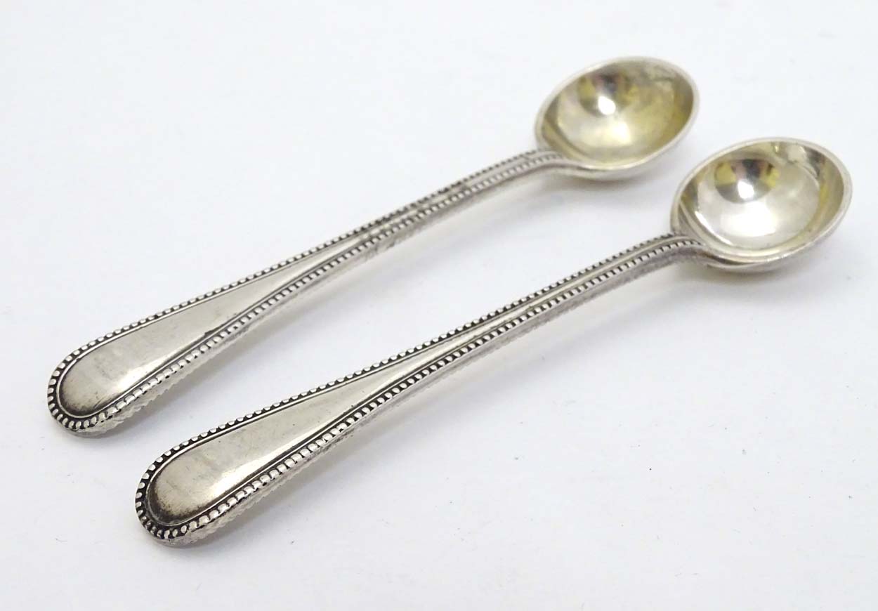 A pair of Victorian silver bead edge salt spoons hallmarked London 1886 maker John Aldwinckle & - Image 3 of 5