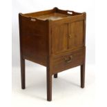 A late 18thC mahogany tray top bedside cabinet with draw out bottom section,
