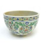 A Chinese Doucai jardiniere, with lotus scroll decoration across body,
