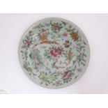 A Chinese Celadon famille rose dish , decorated with exotic birds,