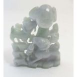 A Chinese green / grey coloured jade carving depicting goats eating at a tree.