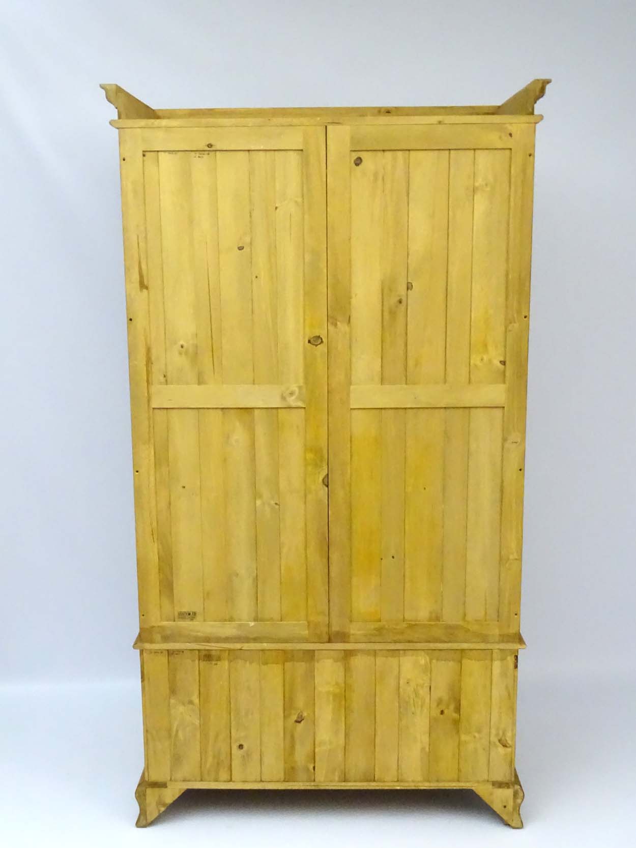 A mid / late 20thC pine wardrobe with an ovolo moulded top above two doors containing storage space - Image 6 of 9