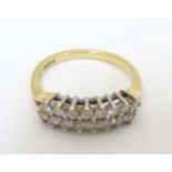 An 18ct gold ring set with 2 bands of diamonds CONDITION: Please Note - we do not