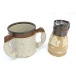 Two ceramic items comprising an early 20thC Royal Doulton stoneware salt glazed jug with swivel lid