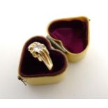 An 18ct gold ring set with central diamond CONDITION: Please Note - we do not make